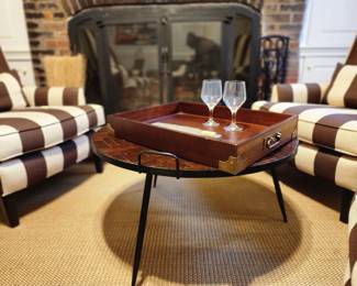 Tri-legged coffee table with handles, wooden serving tray.