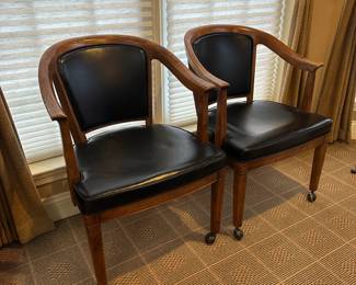 R75 - $250 - PAIR Henredon Furniture Rolling Banker Chairs. Measures 24" wide x 24" deep x 32" tall. Leather is in good condition on both but foam in the seats is showing signs of age!