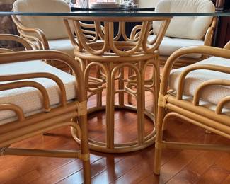 R29 - $1200 - Brown Jordan Round Rattan Glass Top Table with 4 chairs. Measures 4' round x 28.5" tall. Gently used - has been in climate controlled storage so it may need a light cleaning! All Chairs are sturdy. No issues noted with table or glass.
