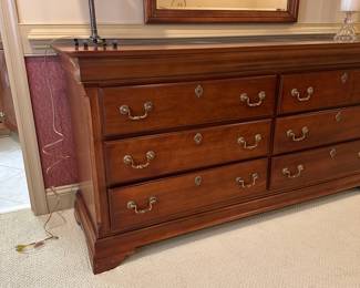 R47 - $150 - Long Triple Dresser. Measures 66" long x 19" deep x 32" tall. All drawers slide easily. No name - back says Made in Dublin GA.