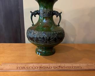 R97 - $65 - Metalware Vase Measures 6.5" wide x 8.5" tall.