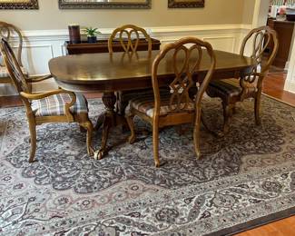 R9 -$275 -Dining Room Table with 8 Chairs. Measures 44" wide x 6' long. 2 captains chairs - 6 regular. Includes 1 leaf - 15" wide. Top does have some wear - see photos. Very sturdy!
