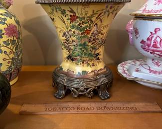 R95 - $50 - Heavy Porcelain & Metal Vase. Measures 8.5" wide x 9" tall.