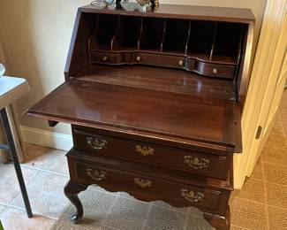 R61 - $125. Ethan Allen Slope Lid Secretary Desk. Measures 26" wide x 18" deep x 40" tall.