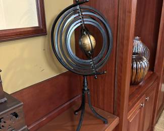 R81 - $75 - Metal Armillary Sphere with 3 legged base. Measures 25" tall.