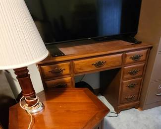 Smart t.v. & small desk.
