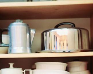 Vintage cake plate and percolator coffee pots.