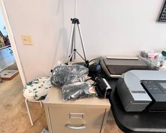 File cabinet, electronic cords, cameras