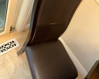 Comfy chairs (with wear on seams) and serviceable table