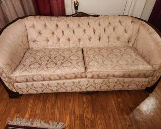 Antique couch with matching chair.