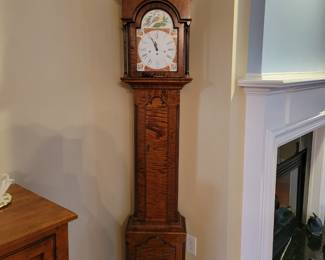 Tiger maple Grandfather clock.
Maker is Gregg Perry.
The value is only in the tiger Maple case as the works have been replaced and it may not run.