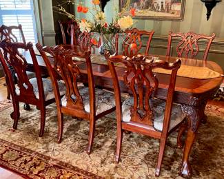 Unusual Table and 8 chairs carved not only on the front but also on the back of the chairs so that you can enjoy them from across the room when not seated at the table.