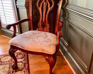 Unusual Table and 8 chairs carved not only on the front but also on the back of the chairs so that you can enjoy them from across the room when not seated at the table.