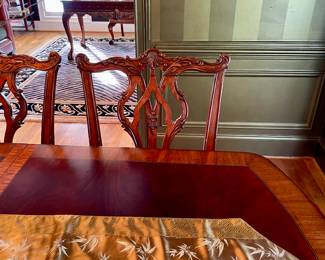 Unusual Table and 8 chairs carved not only on the front but also on the back of the chairs so that you can enjoy them from across the room when not seated at the table.