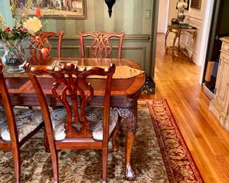 Unusual Table and 8 chairs carved not only on the front but also on the back of the chairs so that you can enjoy them from across the room when not seated at the table.