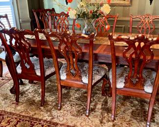 Unusual Table and 8 chairs carved not only on the front but also on the back of the chairs so that you can enjoy them from across the room when not seated at the table.