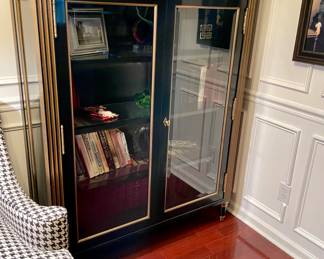 Exceptional bookcase ebony with gilt and glass.