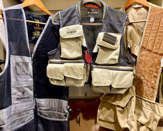 Two closets full of quality fishing and hunting vests and jackets. Folsom, Simms, Browning. 
