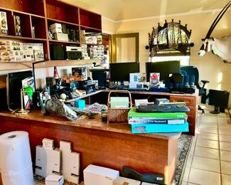 Upstairs office full of electronics, models, taxidermy.