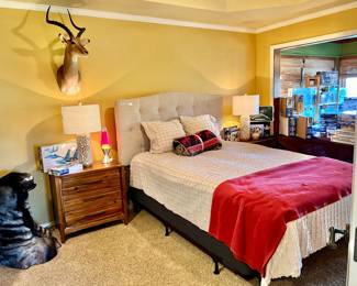 Guest bedroom with queen upholstered bed. 