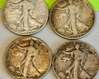 Silver walking Liberty coins.