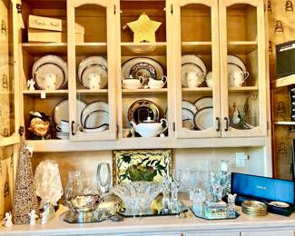 China hutch with Baccarat, Waterford, and china. 