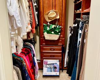 Women’s closet plus 2 clothes racks. 