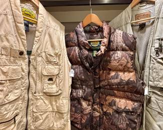 LOTS OF FANTASTIC HUNTING AND FISHING VESTS, JACKETS, AND GEAR.  FILSON, CAMEL, CABELAS, ORIVS, EDDIE BAUER, DUXBAC, CALIBER, WINCHESTER, CACTUFLAGE.