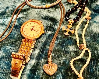 Lagos heart necklaces, David Yurman cuff, Michael Kors watch. 