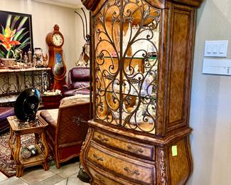Lovely curio cabinet with wrought iron doors.