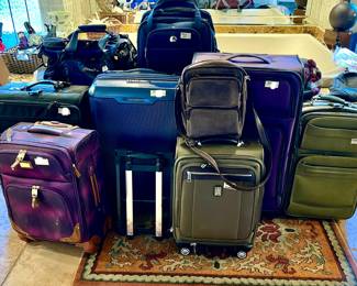 QUALITY LUGGAGE IN THE LARGE MASTER BATHROOM.