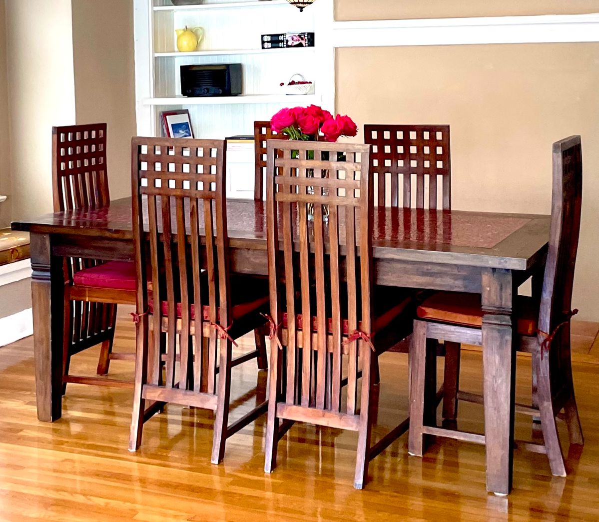 Mission Style Mosaic Tile top table and 6 chairs.  
Table measures 3’  6” wide by 6’ 6” long x  30” high
6 high back wood chairs with cushions included.
