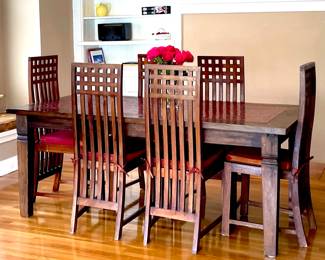 Mission Style Mosaic Tile top table and 6 chairs.  
Table measures 3’  6” wide by 6’ 6” long x  30” high
6 high back wood chairs with cushions included.
