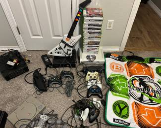 xBox 360 (2 consoles) bunch of games. Another xBox, Playstation, Nintendo 64 with games (not pictured yet) and more.