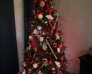 All red and white candy canes, ornaments, tree topper, tree skirt available. Tree is already gone.