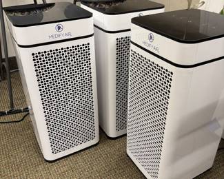 Three Medify Air air purifiers.