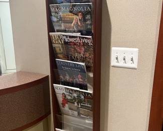 Seven-pocket wood wall magazine rack.