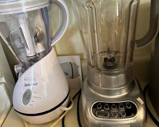 several blenders and other small kitchen appliances 