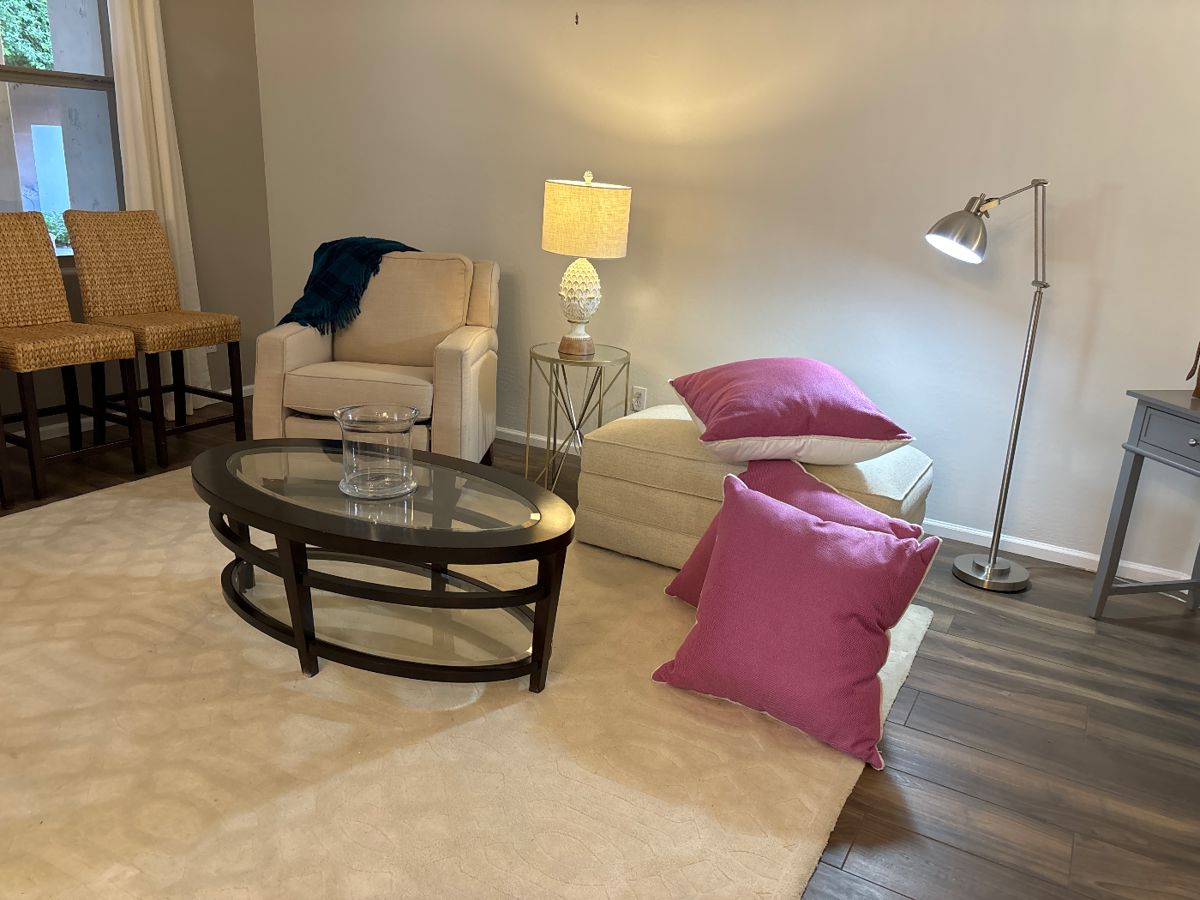 oval glass top table, Laz-Boy chair, storage ottoman. large pillows, counter high bar stools