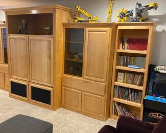 Large entertainment center, bookcase, and sectional  
