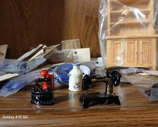 Lots of dollhouse furniture items.