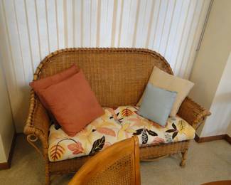 Wicker couch with all the trimmings