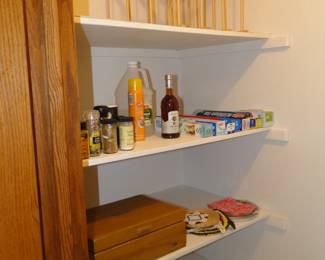 The very top right item is attached, and holds cookie sheets, and long trays, just in case you wanted to make one at home. We do like to inspire and foster creativity. The spices and everything else are for sale