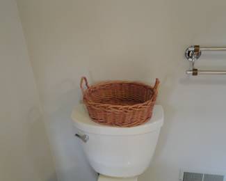 We would like to call this, "Woven Rattan Basket on Toilet". It really is a remarkable piece of art