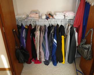 Men's clothing is on the right, and the women's clothing is on the left. Both men's and women's clothing are clean as can be