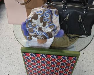 Fendi Givenchy bags
Gucci desk mat
Emilio Pucci fur and silk hat
