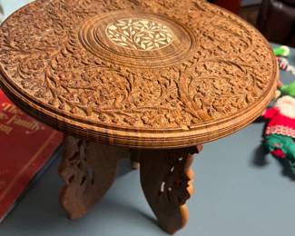 carved small wooden table with folding pedestal