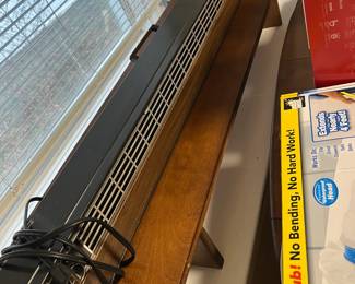 Portable baseboard style electric heater
