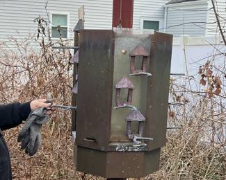 bird feeder slides down with release to load bird food, feed panels slide out top for cleaning