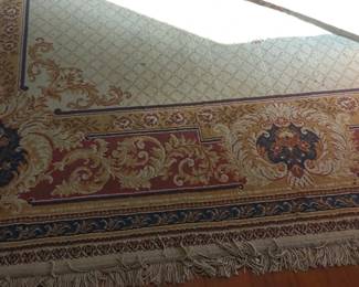 Two beautiful 9x12 area rugs that are both the same one in the entry hall and one of the dining room